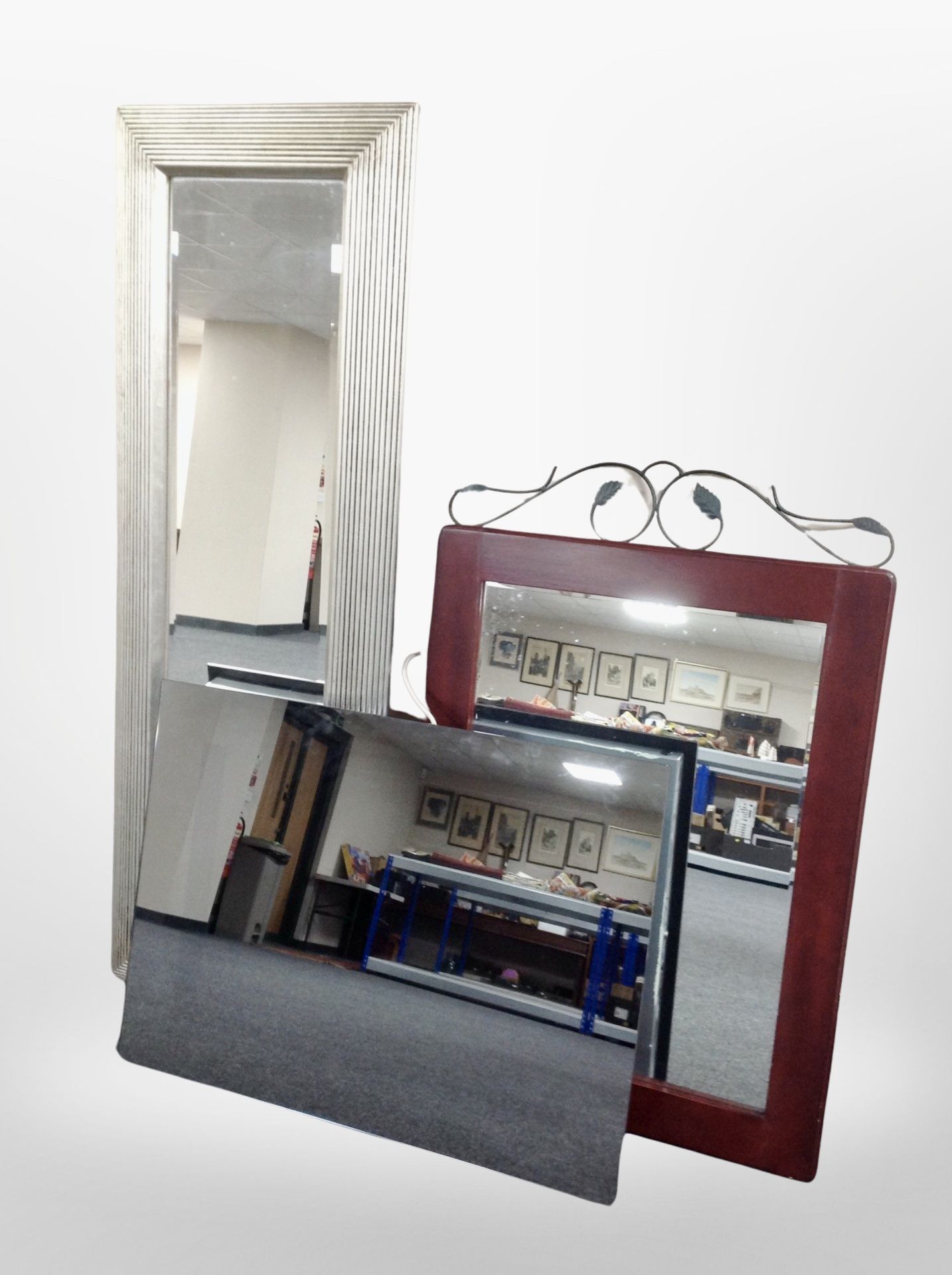 A rectangular silver-framed mirror, length 140cm, together with a further mirror and a light mirror.