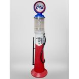 A plastic sweet dispenser in the form of a Esso petrol pump, height 226cm.