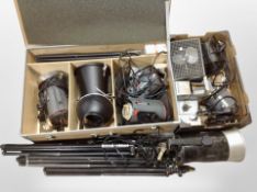 A crate and box containing stage lighting, tripods, camera filters, etc.
