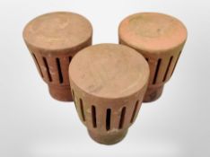 Three terracotta chimney flue caps,