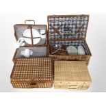 Four wicker picnic hampers, two with part contents.