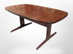 A 20th century Danish rosewood effect extending table with two leaves,