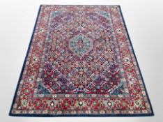 A machine made Tabriz design rug,