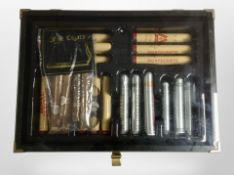 A counter top cigar display cabinet containing a selection of cigars, to include Royal Jamaica,