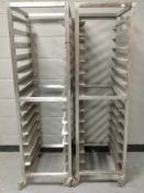 Two stainless steel shelved catering trolleys on castors,