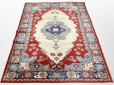 A machine made rug of Caucasian design,