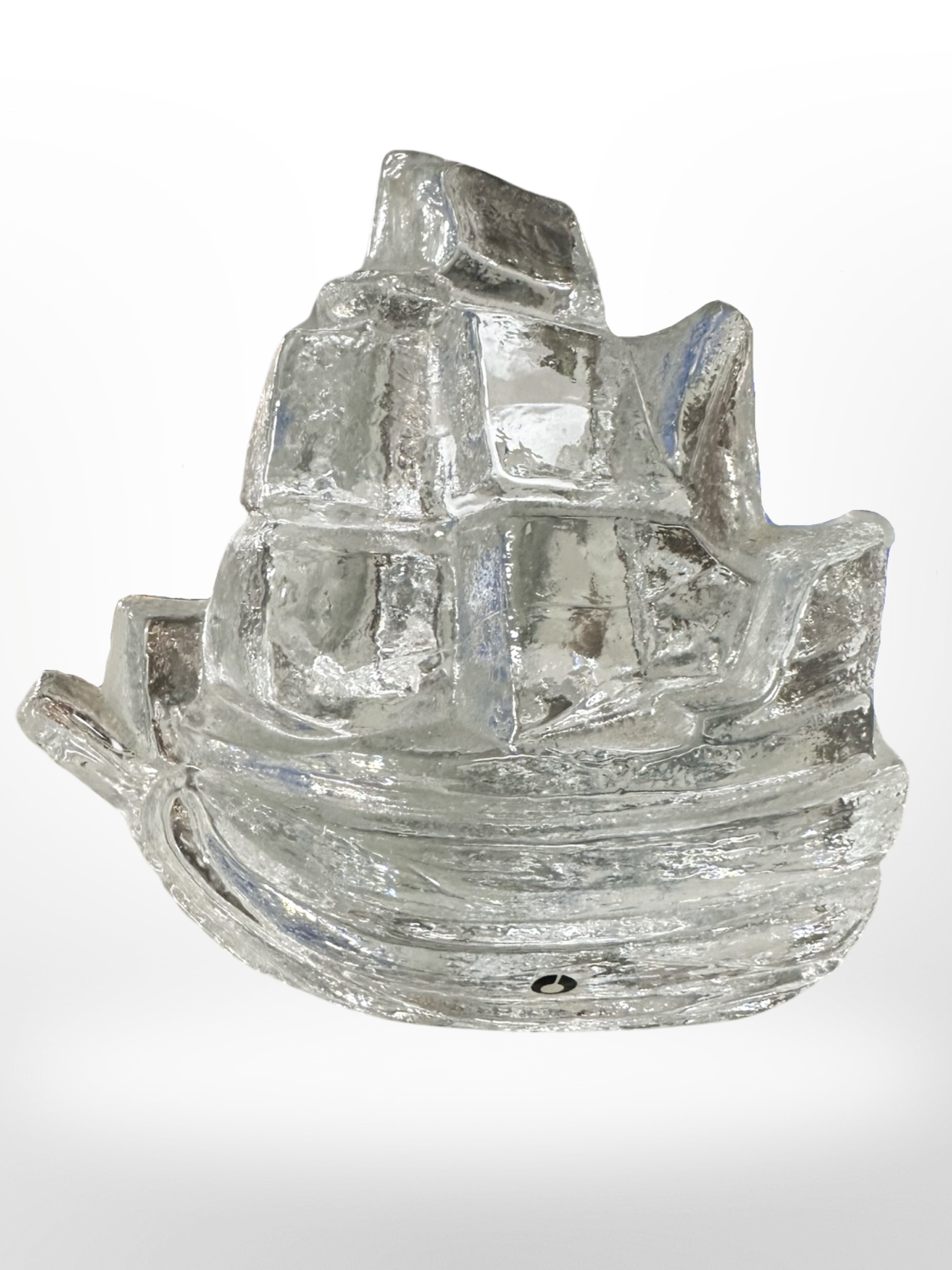A Swedish Westerberg design solid glass paperweight in the form of a galleon.