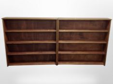 A pair of stained pine contemporary open bookcases,
