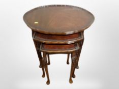 A nest of three beech oval tables,