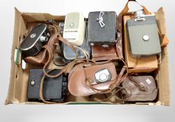 A collection of vintage cameras and handheld video cameras including Keystone, Mamiya, etc.