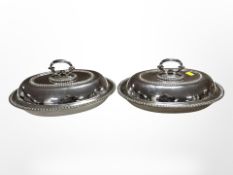 A pair of silver-plated entrée dishes with lids,