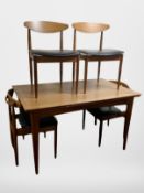 A teak G Plan pull out extending dining table,