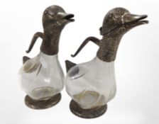 A pair of glass and silver plate decanters in the form of ducks, height 27cm.