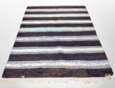 A late 20th century carpet on blue ground,