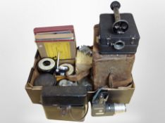 A box containing photographic items including contact sheet printer, Pressgrip cine title outfit,