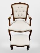 A French carved beech salon armchair with matching footstool