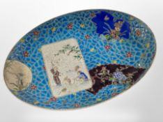 An oriental earthenware oval dish, length 36cm.