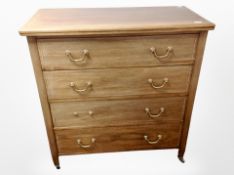 An Edwardian mahogany and satinwood inlaid chest of four drawers,