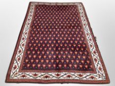 A Persian style wool rug,