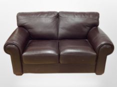 A contemporary brown stitched leather two-seater settee, width 160cm.