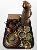 A group of metal wares including embossed copper flagon and casket, horse brasses, large brass key,