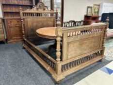 A 19th century French oak double bed frame, 206 cm long x 146 cm wide x 150 high at headboard,