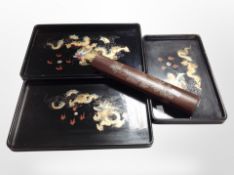 Three graduated oriental lacquered trays,