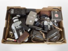 A collection of vintage cameras and handheld video cameras including Canon Super 8 camera, Konica,