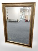A contemporary gilt overmantel mirror,
