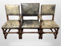 A set of six oak and studded leather dining chairs