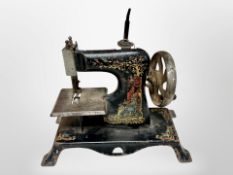 A Victorian miniature sewing machine, height 20cm.