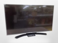 An LG 43 inch LCD TV with lead and remote