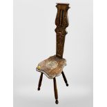 A 19th century carved oak spinning chair,