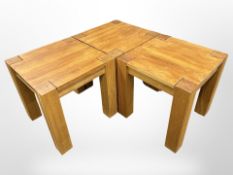 A set of three contemporary square oak lamp tables,