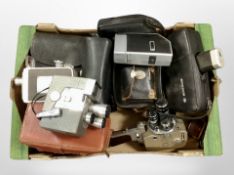 A group of vintage cameras and handheld video cameras including Sankyo, Wollensak, etc.