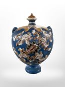 An oriental export earthenware vase with stopper, height 23cm.