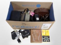 A box containing cameras including Cowen's idol box camera, Carena handheld video camera,
