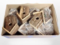 A box of new rustic bird boxes.