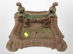 A cast iron boot scraper