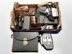 A group of vintage cameras and handheld video cameras including Bolex, Bell and Howel, etc.