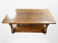 A reproduction oak coffee table,