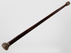 A walking stick with silver pommel, length 75cm.