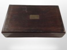 A part set of antique drawing instruments in a rosewood brass-inlaid fitted box.