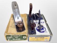 A Stanley Bailey No. 4 woodworking plane in original box, and a further record plane in box.