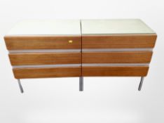 A pair of Opus 22 MDF and teak three drawer chests,