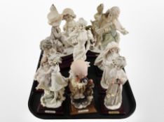 A group of G Armani Italian figures, with further lamp base.