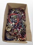 A box of assorted costume jewellery, bead necklaces, bangles, etc.