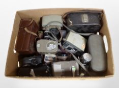 A collection of vintage cameras and handheld video cameras including Eymig, Fujica, etc.