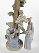 A Nao figure group of two musicians (restored), together with two further Spanish figures.
