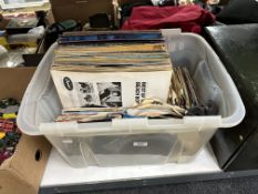 A box of LP records and 45 singles, including compilations, the Beach Boys, Simon and Garfunkel,